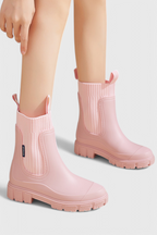 Women’s pink slip-on ankle boots with ribbed elastic gore and chunky tread sole