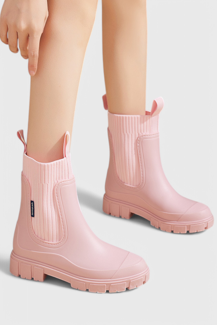 Women’s pink slip-on ankle boots with ribbed elastic gore and chunky tread sole