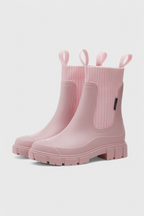 Pink slip-on ankle boots with ribbed elastic shaft and side gore pull-on panel.