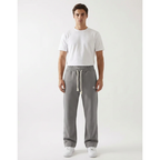 Unisex baggy joggers in gray with drawstring ties, side pockets, and relaxed fit