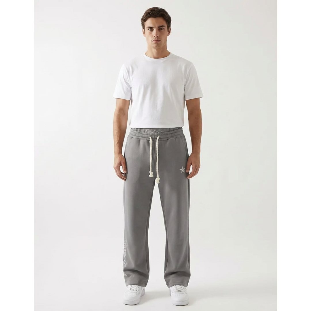 Unisex baggy joggers in gray with drawstring ties, side pockets, and relaxed fit