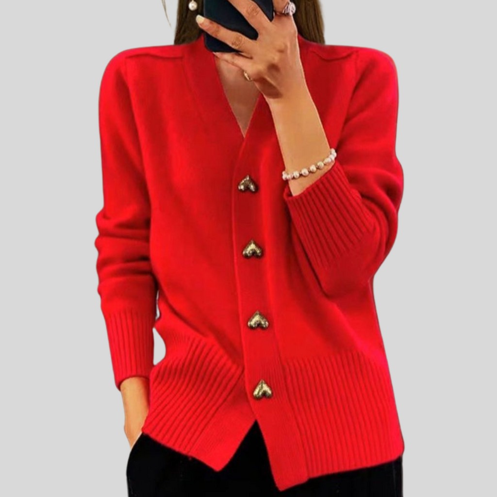 Red cardigan sweater with V-neck, long sleeves, ribbed hem, heart-button front.