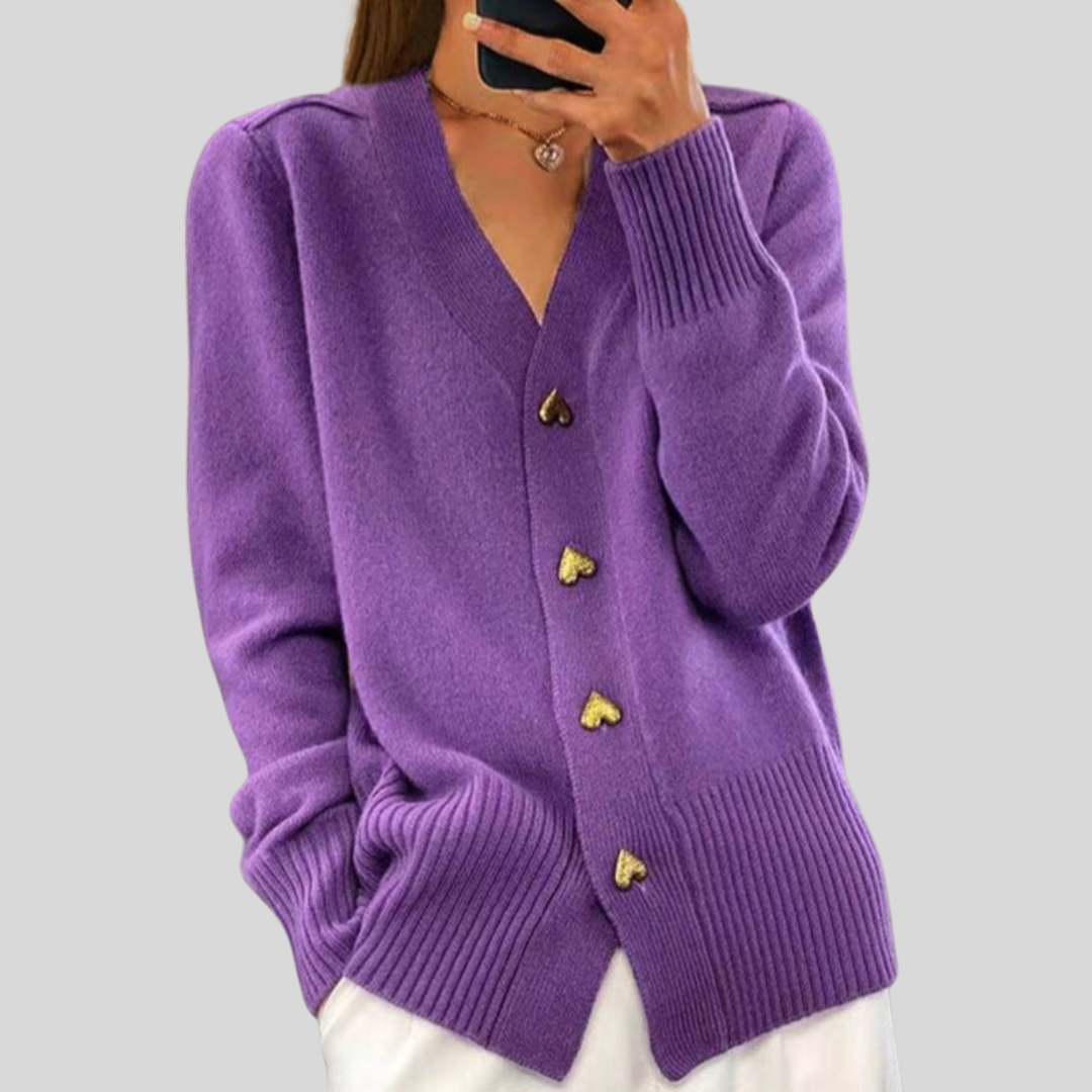 Purple cardigan sweater with V-neck, long sleeves, ribbed hem, heart-button front.