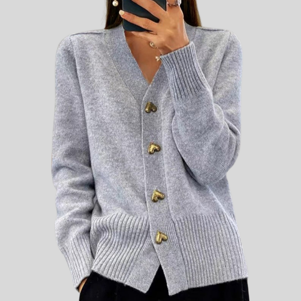 Gray cardigan sweater with V-neck, long sleeves, ribbed cuffs, heart-button front.