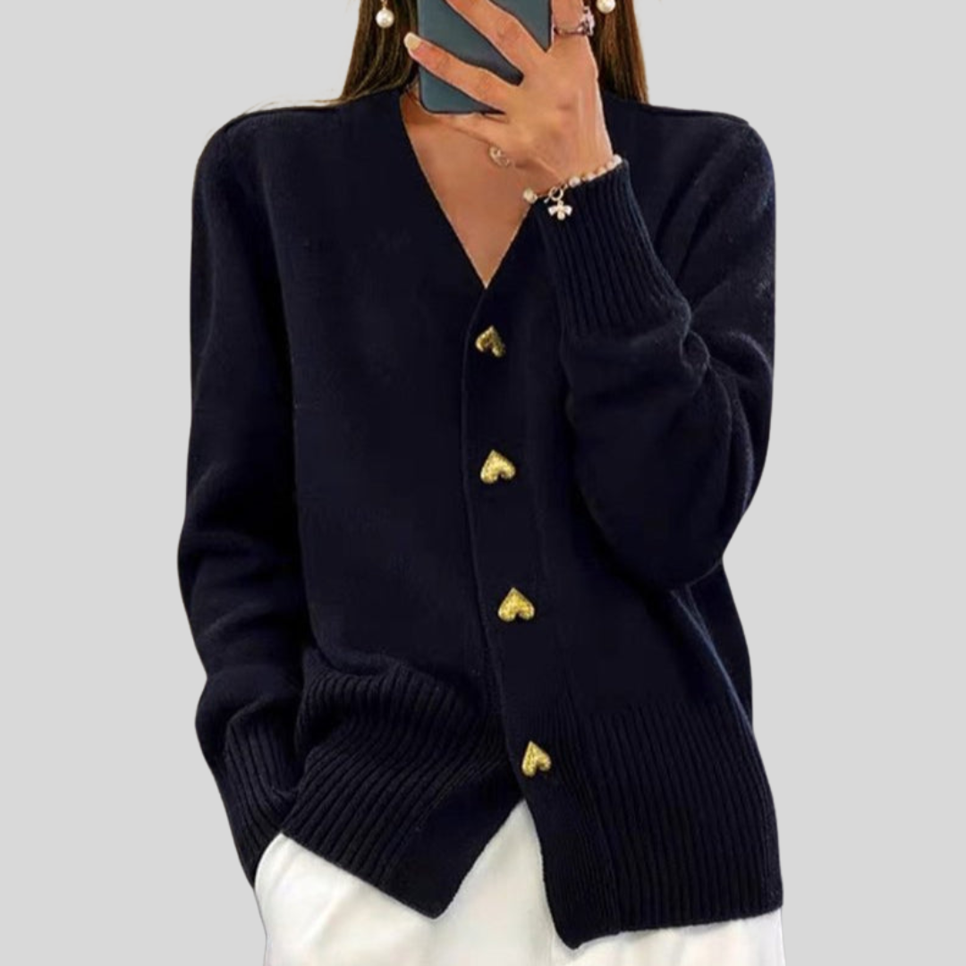 Dark cardigan sweater with V-neck, long sleeves, ribbed cuffs, heart-button front.
