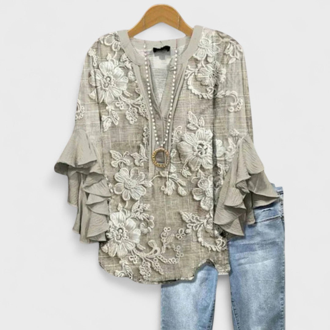 Women’s v-neck blouse with ruffle sleeves, light beige with white embroidered floral pattern