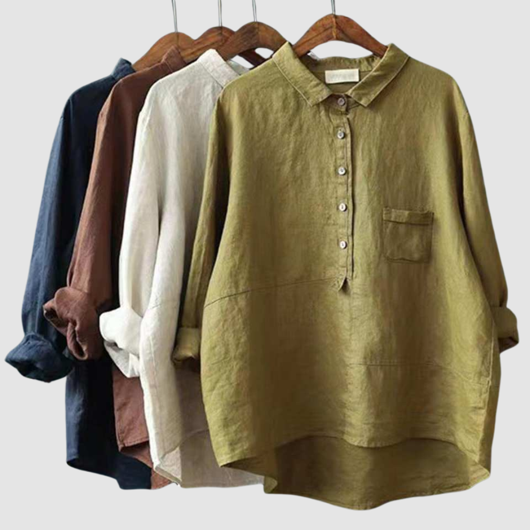 Assorted button-front cotton blouses on hangers in white, olive, and blue tones