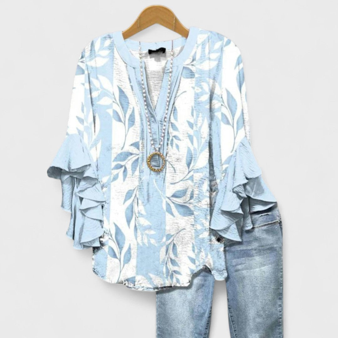 Women’s v-neck blouse with ruffle sleeves, light blue leaf print and beaded trim