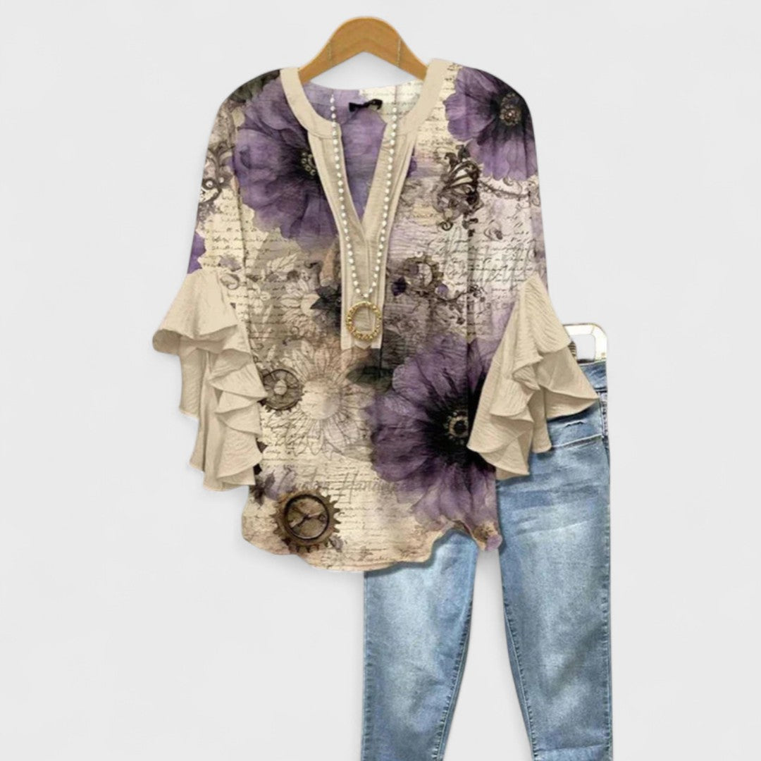 Women’s v-neck blouse with ruffle sleeves, beige base with purple floral watercolor pattern