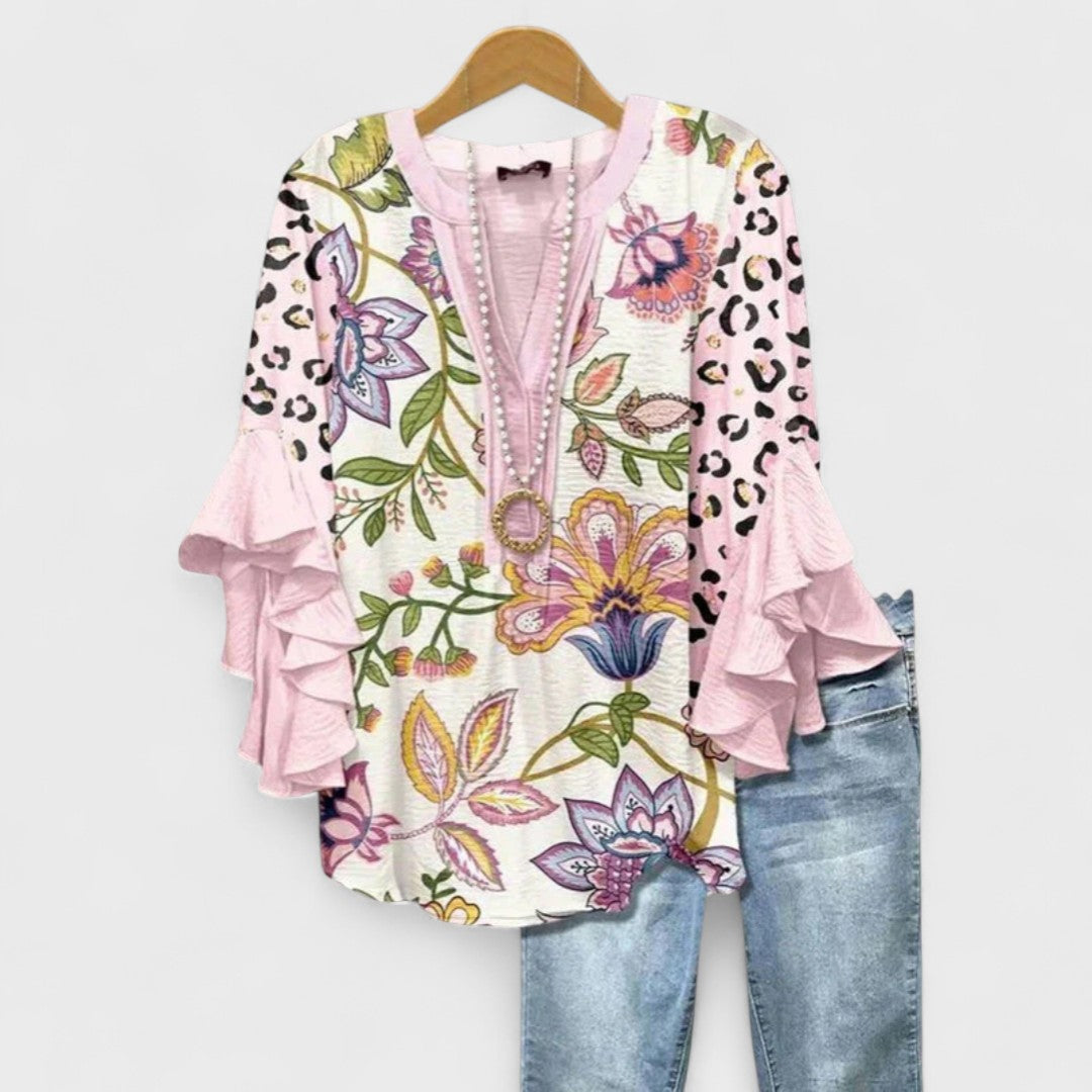 Women’s v-neck blouse with ruffle sleeves, pale pink with colorful floral and leopard print
