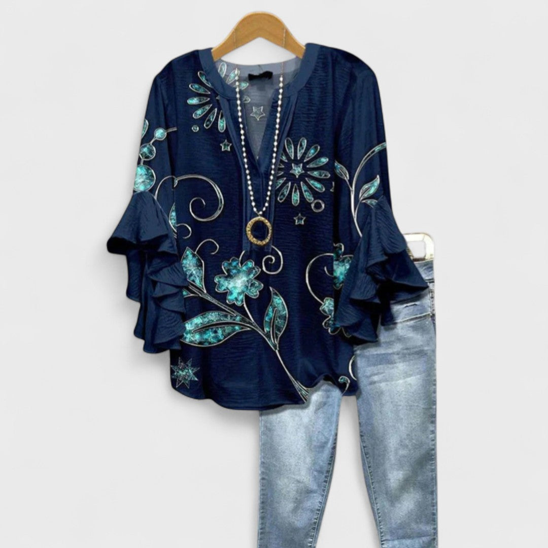 Women’s v-neck blouse with ruffle sleeves, dark navy with teal floral scroll embroidery