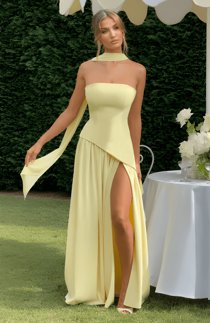 Strapless pale-yellow maxi dress with draped front overlay and high slit