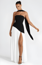 Strapless long slit maxi dress with black bodice and white skirt, side slit