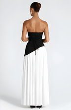 Strapless black and white maxi dress with high slit skirt and draped waist panel
