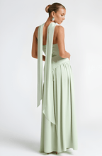 Strapless mint-green maxi dress with backless style and flowing draped skirt