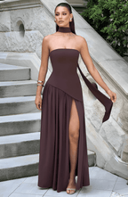 Strapless deep plum maxi dress with high slit and draped overlay at front