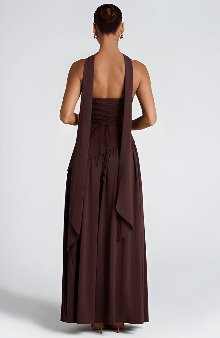Strapless dark plum maxi dress with backless cut and draped skirt detail