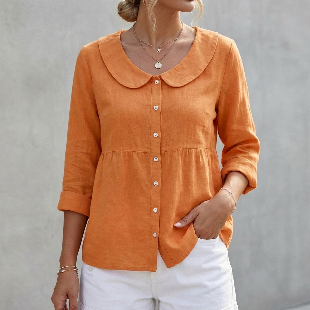 Orange peplum blouse with Peter Pan collar, button front, and three-quarter sleeves
