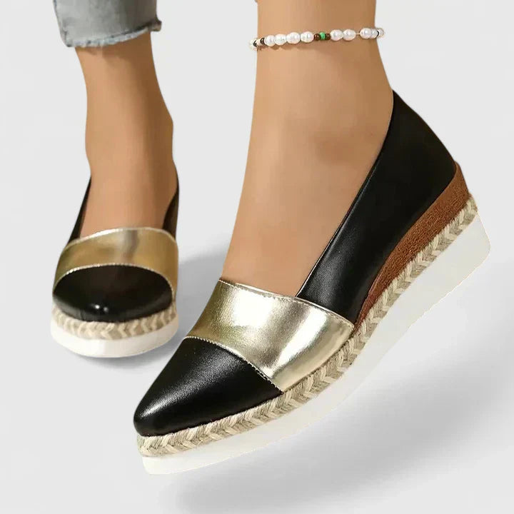 Women's two-tone pointed wedge loafers with metallic toe and black side panels