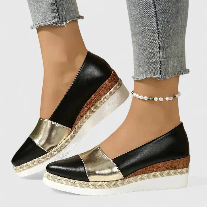Women's low-profile wedge loafers, black upper with metallic toe and espadrille sole