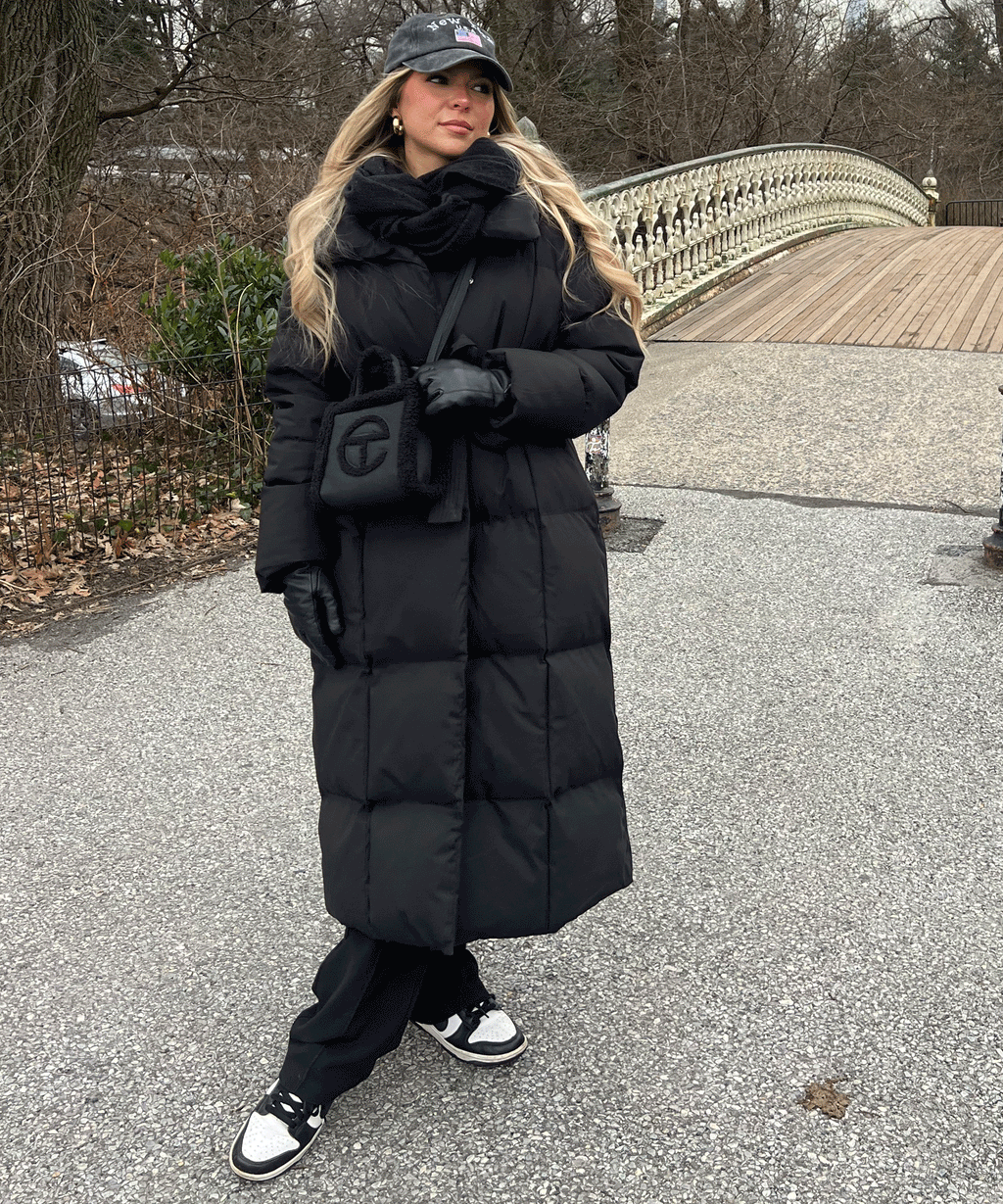 Black long puffer coat with hood and waist belt tie, quilted body and long hem