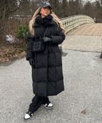 Black long puffer coat with hood and waist belt tie, quilted body and long hem