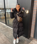 Black maxi puffer coat with hood and tie belt, quilted look and front closure