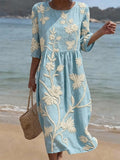 Light blue floral embroidered round-neck midi dress with gathered waist and 3/4 sleeves