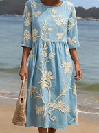Light blue floral embroidered round-neck midi dress with gathered waist and 3/4 sleeves