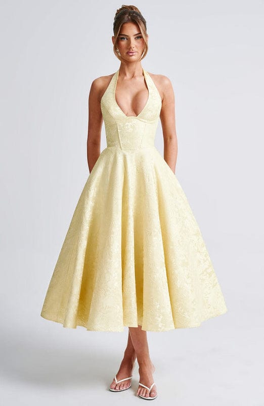 Light yellow sleeveless A-line midi dress with V-neck and gathered skirt.