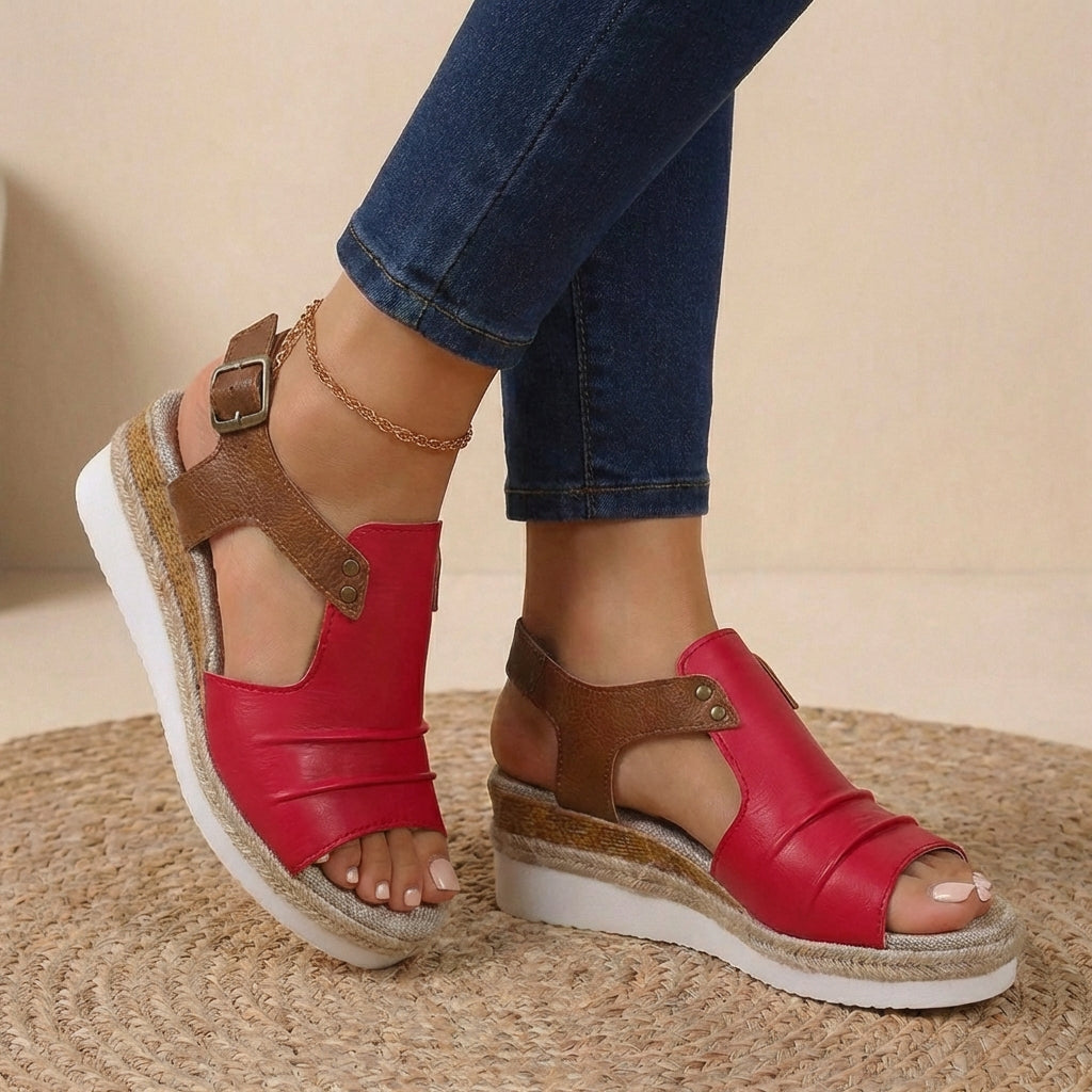 Red and brown platform orthopedic sandals with buckled ankle strap and open toe