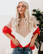 Women’s winter sweater with tan knit body, red sleeves, white chevron front