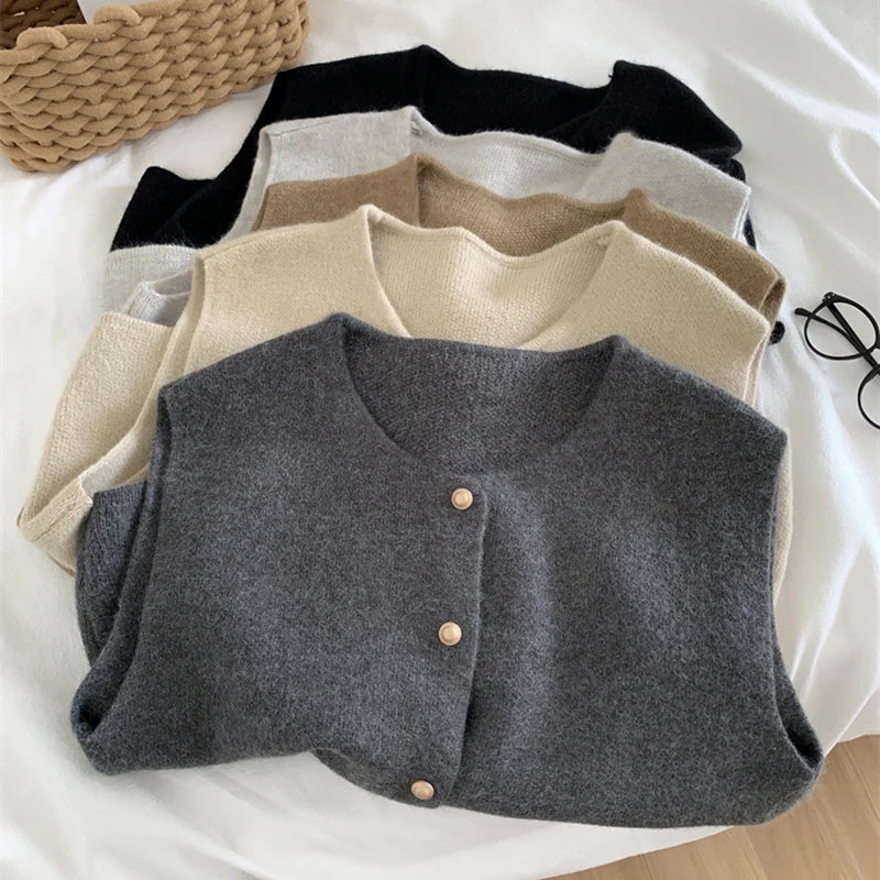 Gray merino wool women’s vest with button-front placket and round neckline
