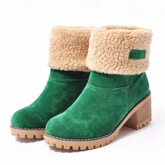 Women’s mid-calf winter boots in green suede with tan shearling cuff and green logo patch
