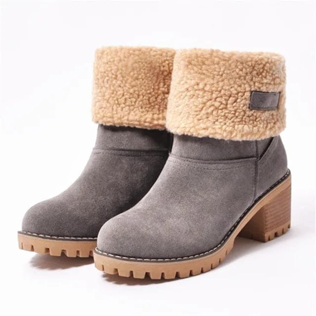 Women’s mid-calf winter boots in gray suede with tan shearling cuff and dark patch