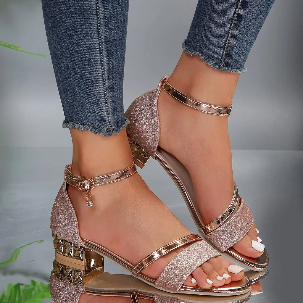 Women’s heeled sandals in rose-gold glitter with ankle buckle and chunky gold heel