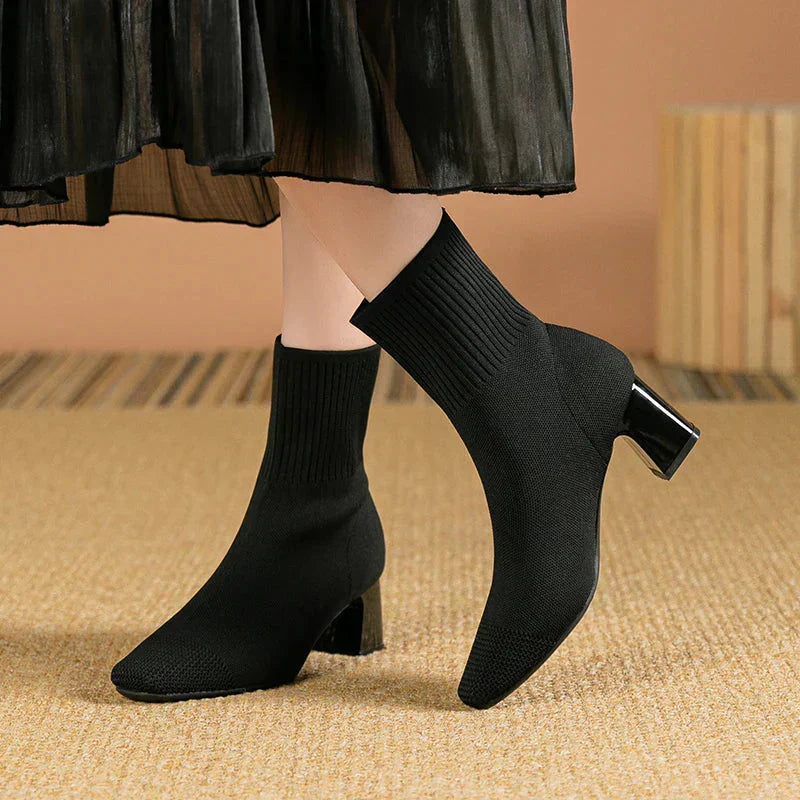 Black knit ankle boots with stretch sock fit and block heel, pointed toe
