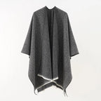 Charcoal cashmere poncho with V-neck, draped sleeves and fringe hem