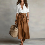 Linen co-ord set with white V-neck blouse and brown tie-waist midi skirt