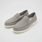 Grey suede slip-on loafers with penny-strap detail and white rubber sole