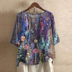 Women’s blouse in blue and purple with multicolor floral print, short sleeves, button front