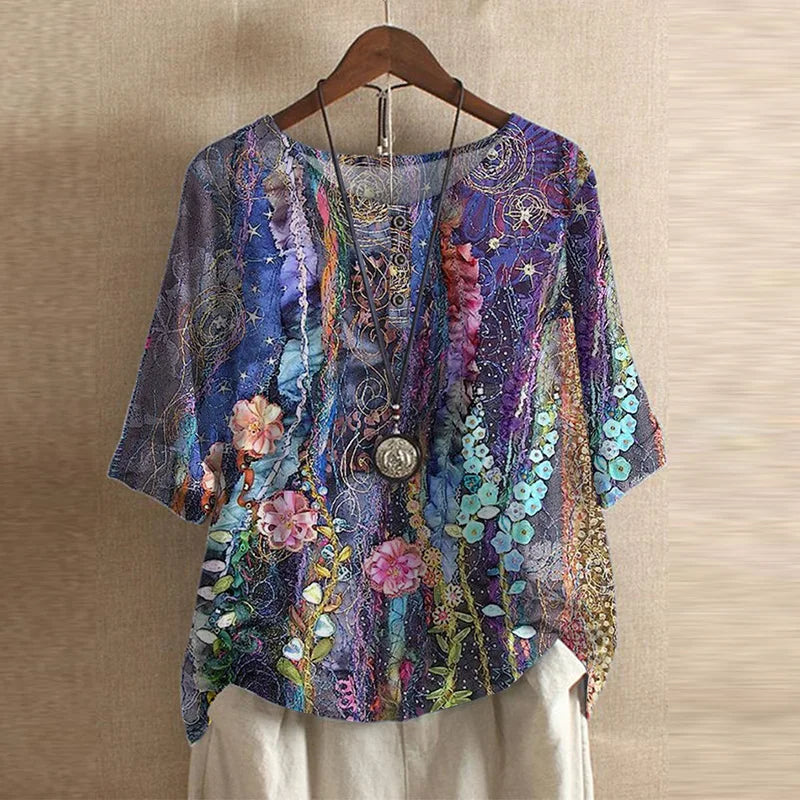 Women’s blouse in blue and purple with multicolor floral print, short sleeves, button front