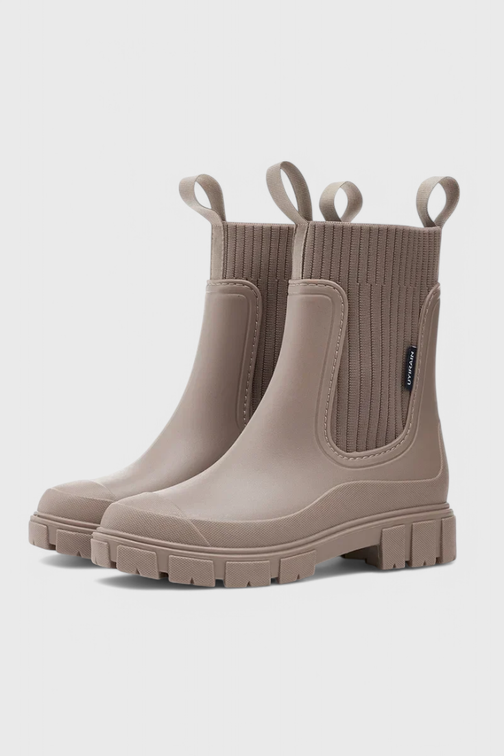 Khaki slip-on ankle boots with ribbed elastic shaft and side gore pull-on panel.
