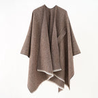 Brown cashmere poncho with V-neck, draped sleeves, fringe hem