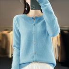 Women’s cardigan sweater, button-front knit, long sleeves, light blue knit.