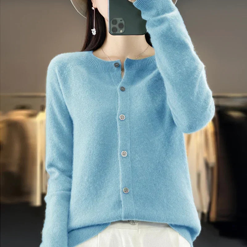 Women’s cardigan sweater, button-front knit, long sleeves, light blue knit.