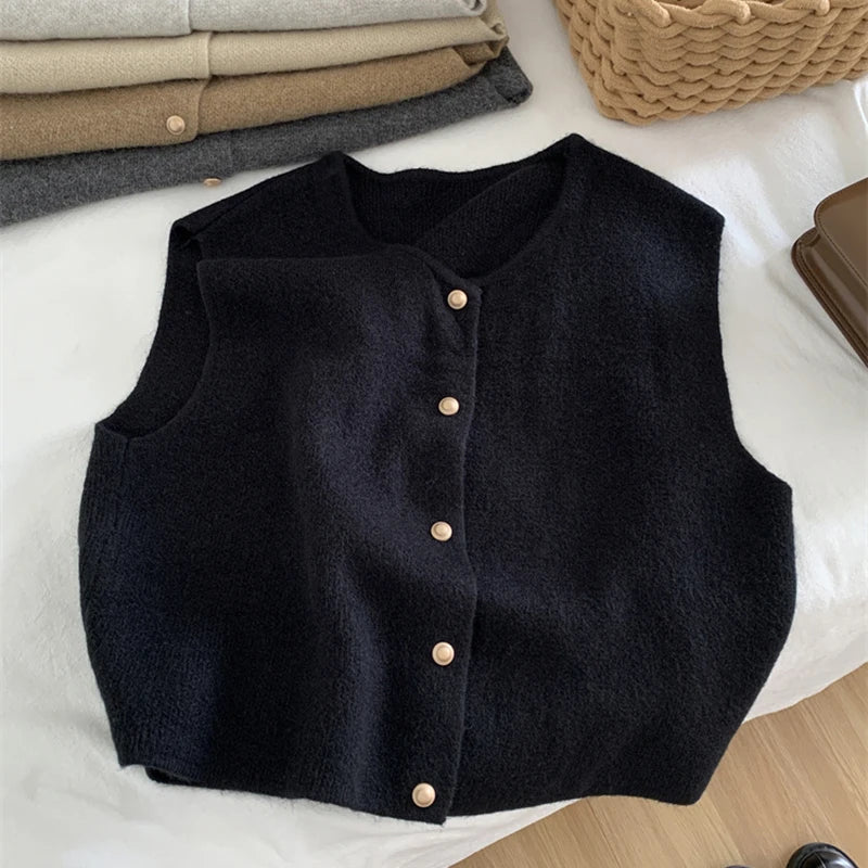 Black merino wool women’s vest with button-front closure and round neckline