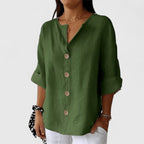 Army green V-neck button-front blouse with cuffed short sleeves and wooden button trim
