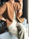 Camel-brown textured knit jacket with button front and stand collar
