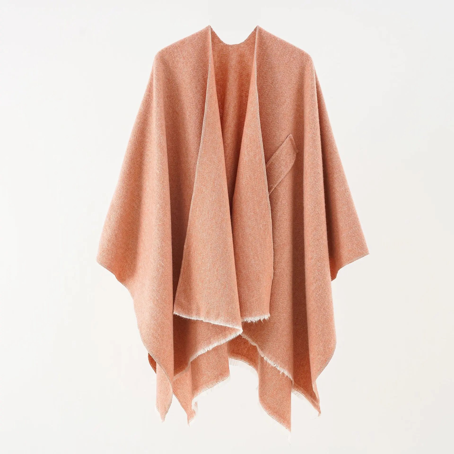 Peach cashmere poncho with V-neck, draped sleeves, fringe hem